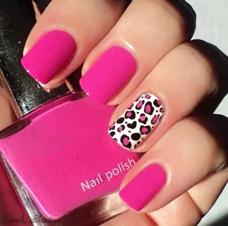 Chic Matte Pink Nails with Playful Leopard Print Accent for a Stylish Statement.