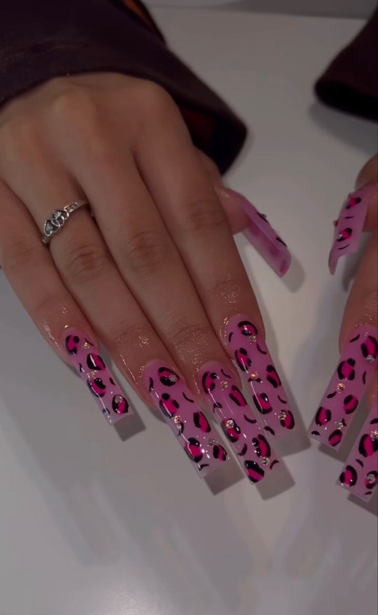 Trendy Glossy Pink Leopard Spot Nail Design with Rhinestones.