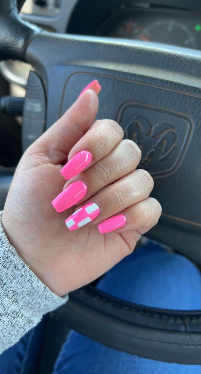 Bold and Playful Pink Nail Art with Trendy White Checkered Design.