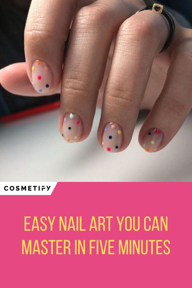 Playful Minimalist Nude Nail Design with Colorful Polka Dots.