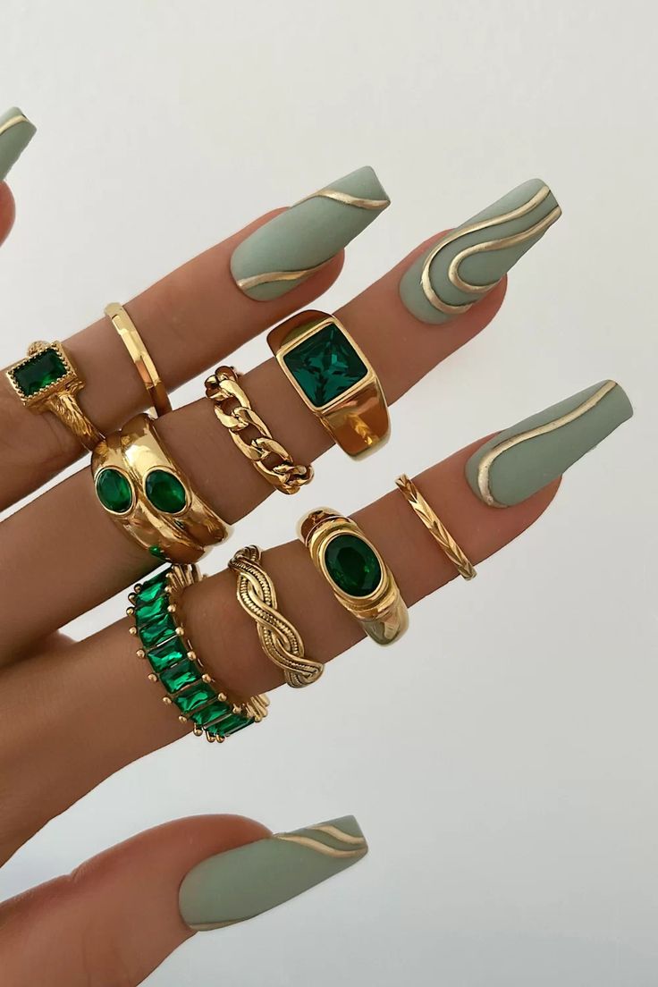 Chic Mint-Green Nails with Wavy Tips and Luxurious Gold-Green Gemstone Rings.