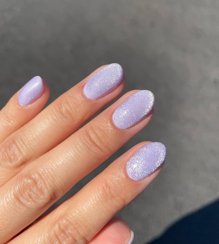 Elegant Lavender Nail Design with Glossy and Glitter Finishes for Playful Charm.