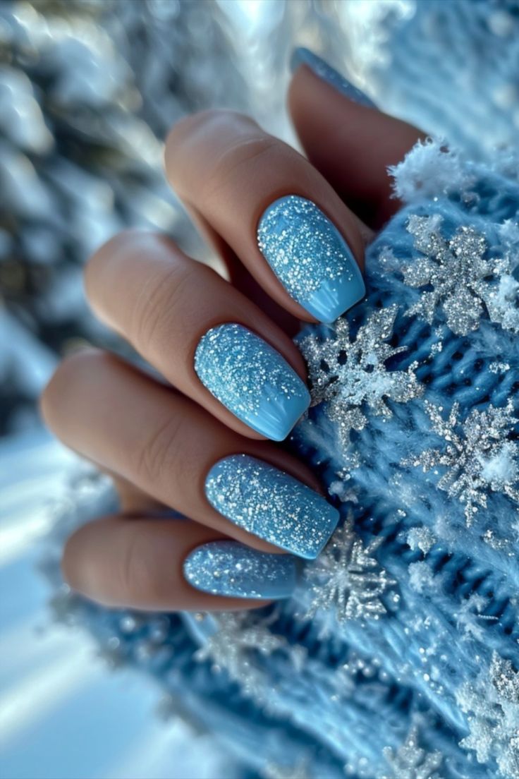 Elegant Winter Wonderland-Inspired Glittery Blue Gradient Nail Design