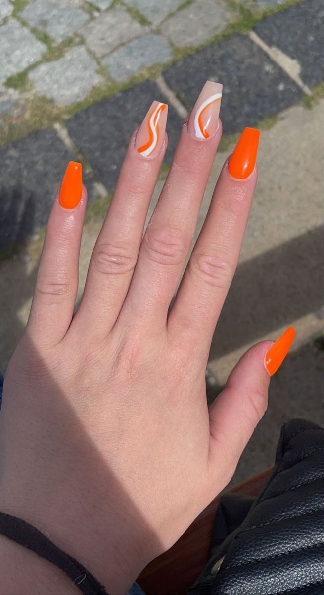 Vibrant Orange Nail Design: Glossy Finishes with Artistic Swirls for a Bold Summer Statement.