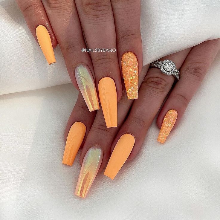 Cheerful Vibrant Orange Nail Design with Gradient, Iridescent Marble, and Glitter Accents.