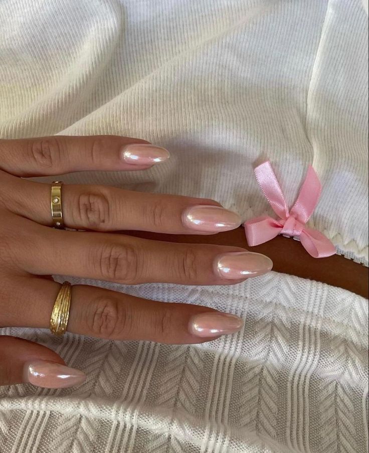 Sophisticated Pearlescent Nails in Gentle Pink: A Chic Choice for Every Occasion.