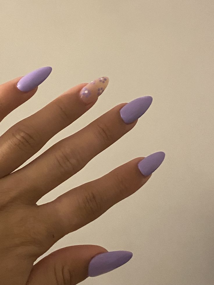 Elegant Lavender Almond Nails with Playful Glitter Accent Design.