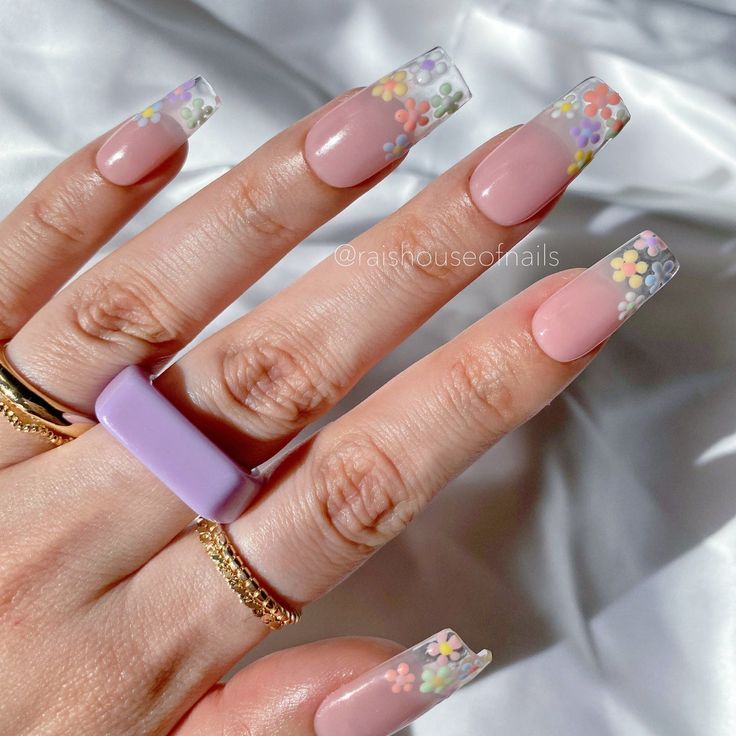 Elegant Floral Nail Design with Pastel Accents on Soft Nude Base