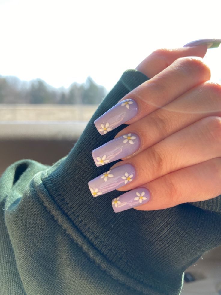 Elegant Lavender Nail Design with Delicate Floral Accents for a Fresh Spring Aesthetic.