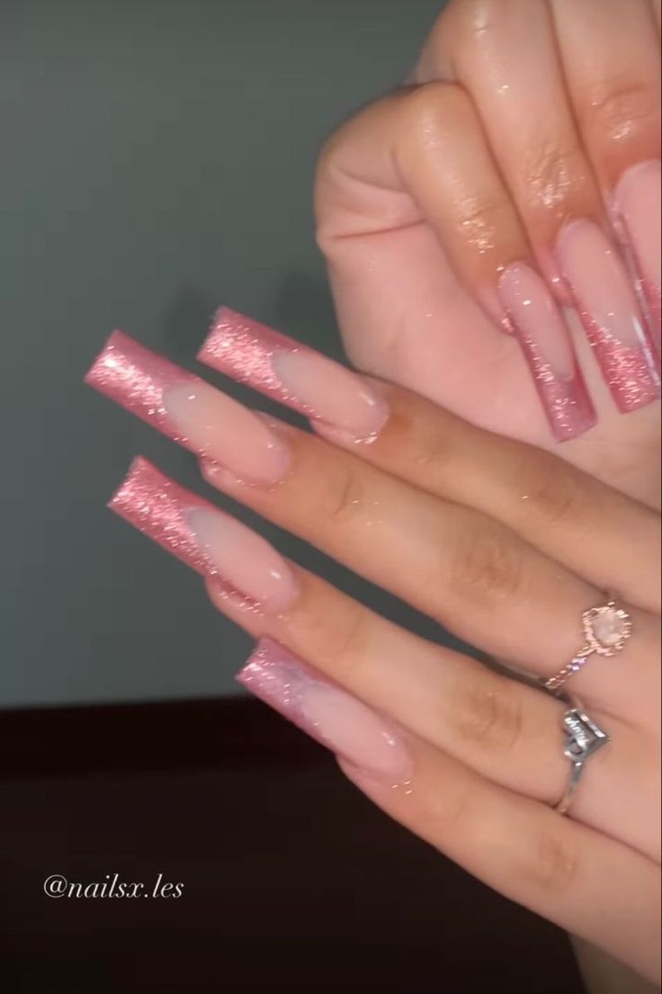 Elegant Glistening Ombre Nails with Soft Pink and Glitter Tips for a Sophisticated Look.