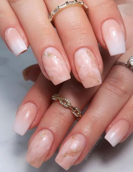 Chic Ombre Nail Design with Subtle Marble Accents and Glossy Finish