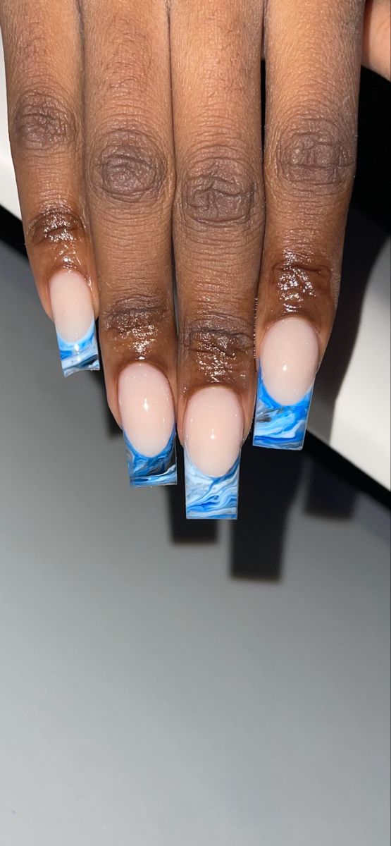 Elegant Marble Blue and White Nail Design with Bold Tips