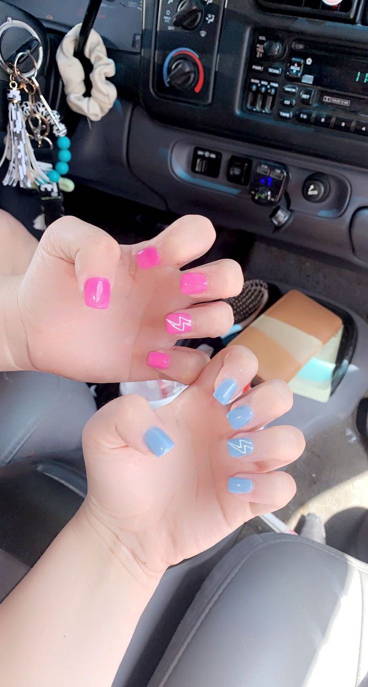 Playful Colorful Nail Art with Bright Pink and Soft Blue Hues