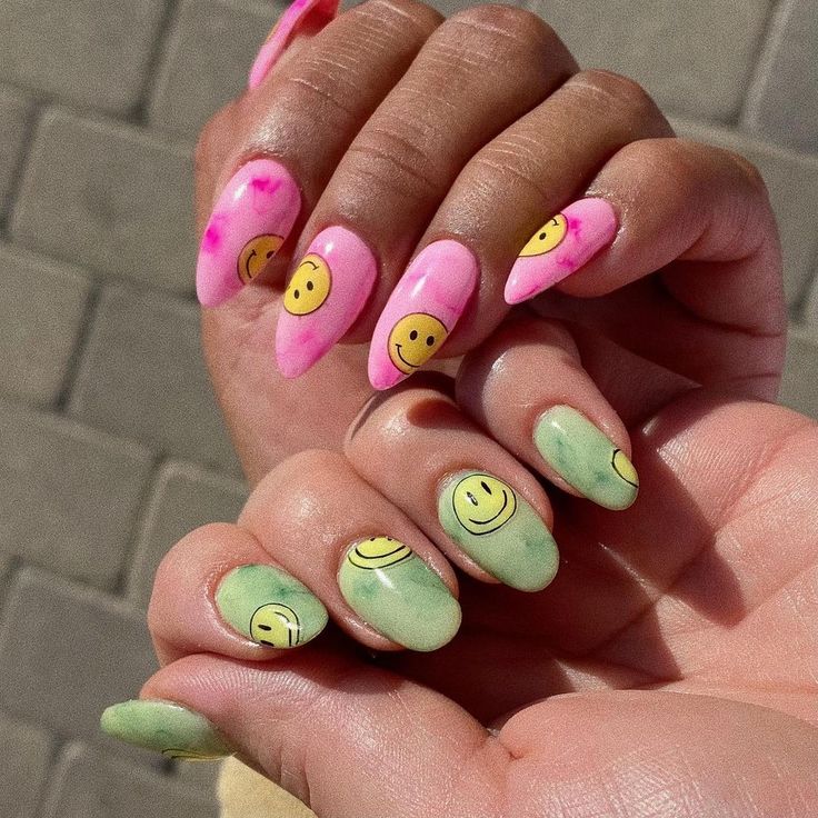 Vibrant Pink and Green Nail Design with Cheerful Smiley Faces for a Fun Aesthetic.