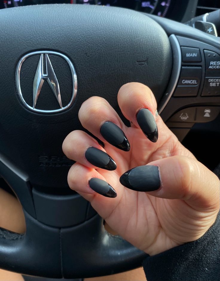 Edgy Sleek Matte Black Nails with Glossy Tapered Tips for a Striking Fashion Statement.