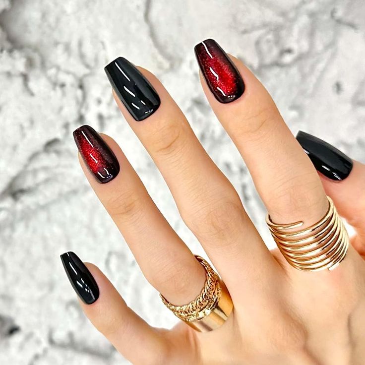 Chic Nail Design with Glossy Black and Deep Red Accents for Sophisticated Flair.