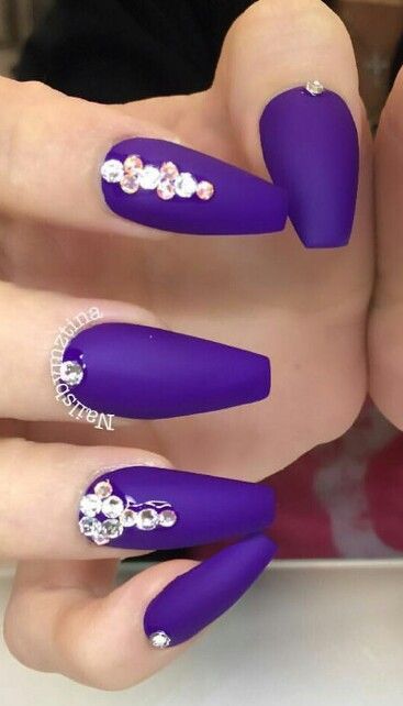 Bold Purple Matte Nails with Sparkling Rhinestones: A Glamorous Statement Design.