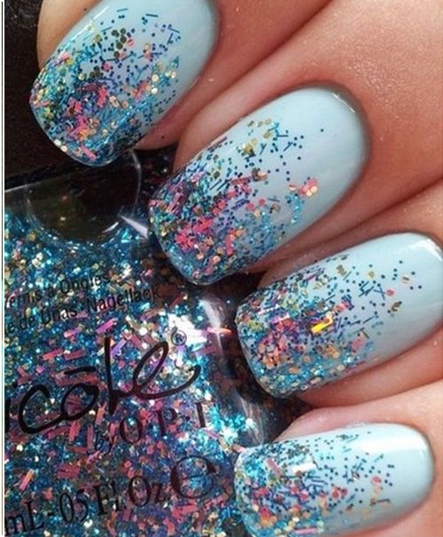 Glamorous Sparkling Blue Ombre Nail Design with Iridescent Glitter.