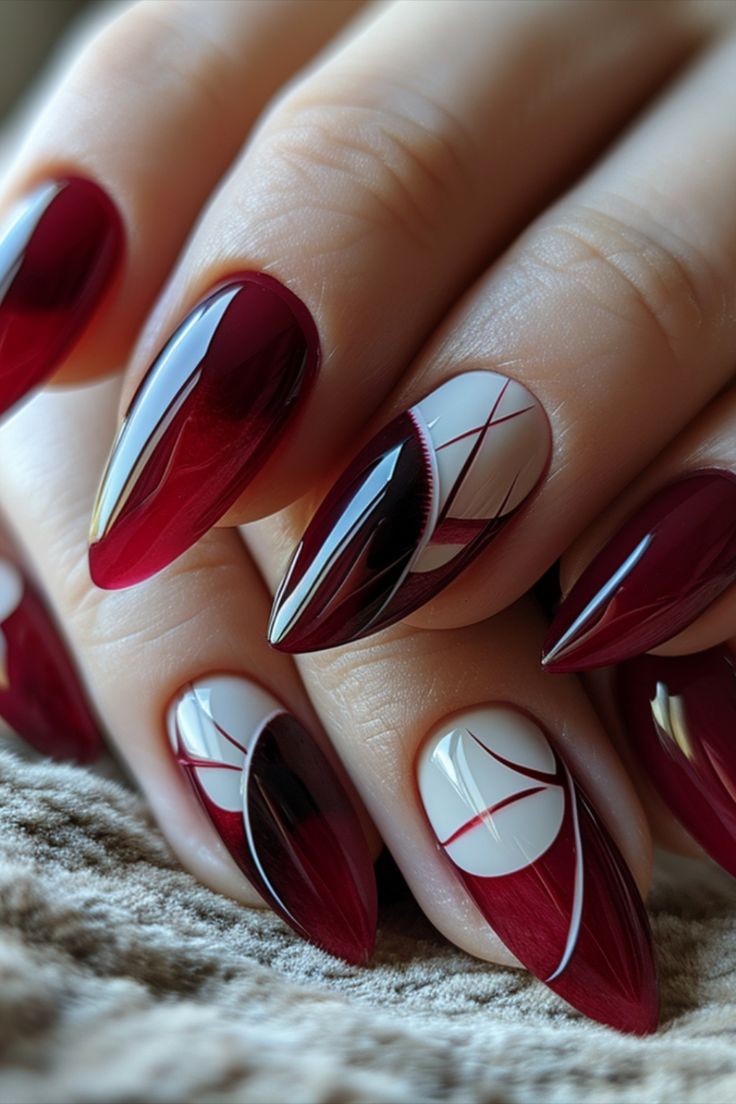 Sophisticated Red and White Nail Design with Geometric Patterns.