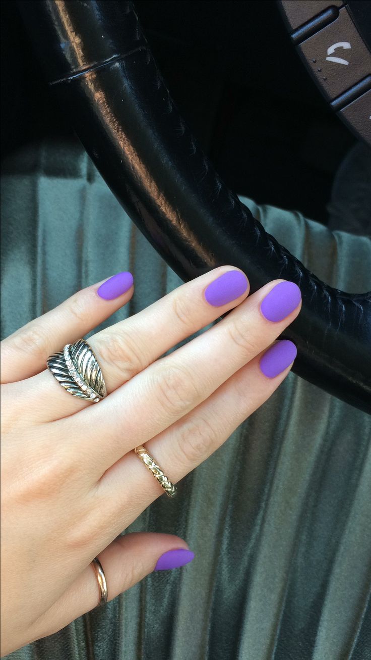 Elegant Vibrant Purple Nails with Matte Finish and Stylish Rings for a Playful Refined Look