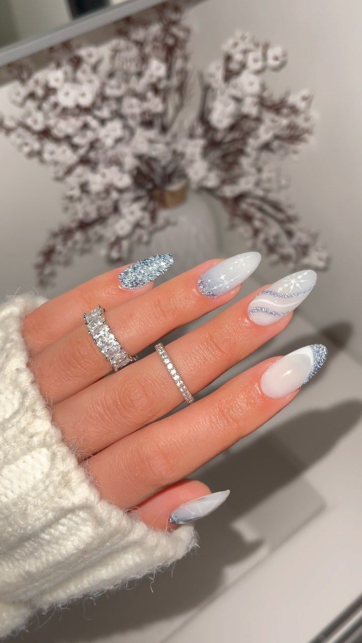 Sophisticated Elegant Nail Design with Glossy White, Shimmering Silver, and Sparkling Accents.