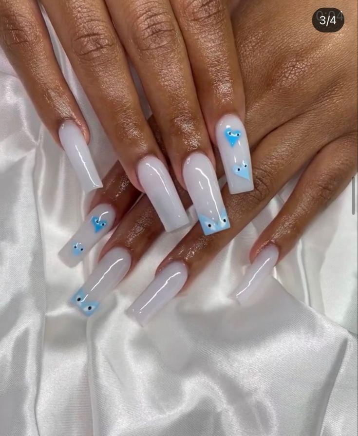 Chic Long Glossy Nails with Translucent White Base and Delicate Blue Accents.