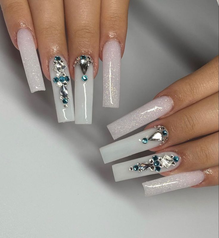 Chic Glamorous Long Square Acrylic Nail Design with Glitter and Embellishments.