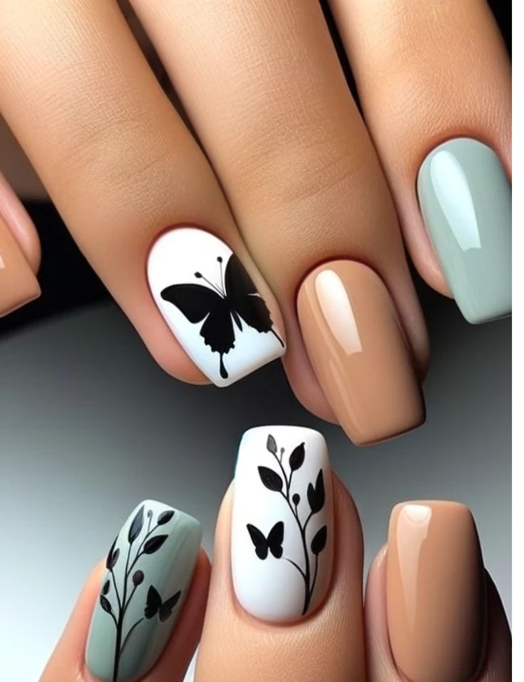 Sophisticated Butterfly-Inspired Nail Design with Delicate Vines and Soft Neutral Tones.