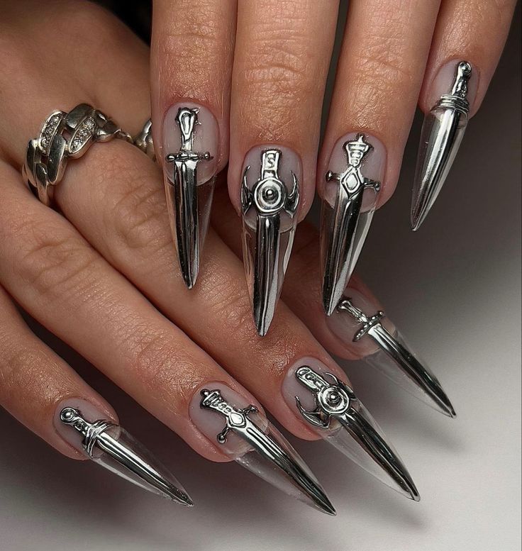 Bold Metallic Sword Stiletto Nails: Edgy Nail Art with a Sleek Finish