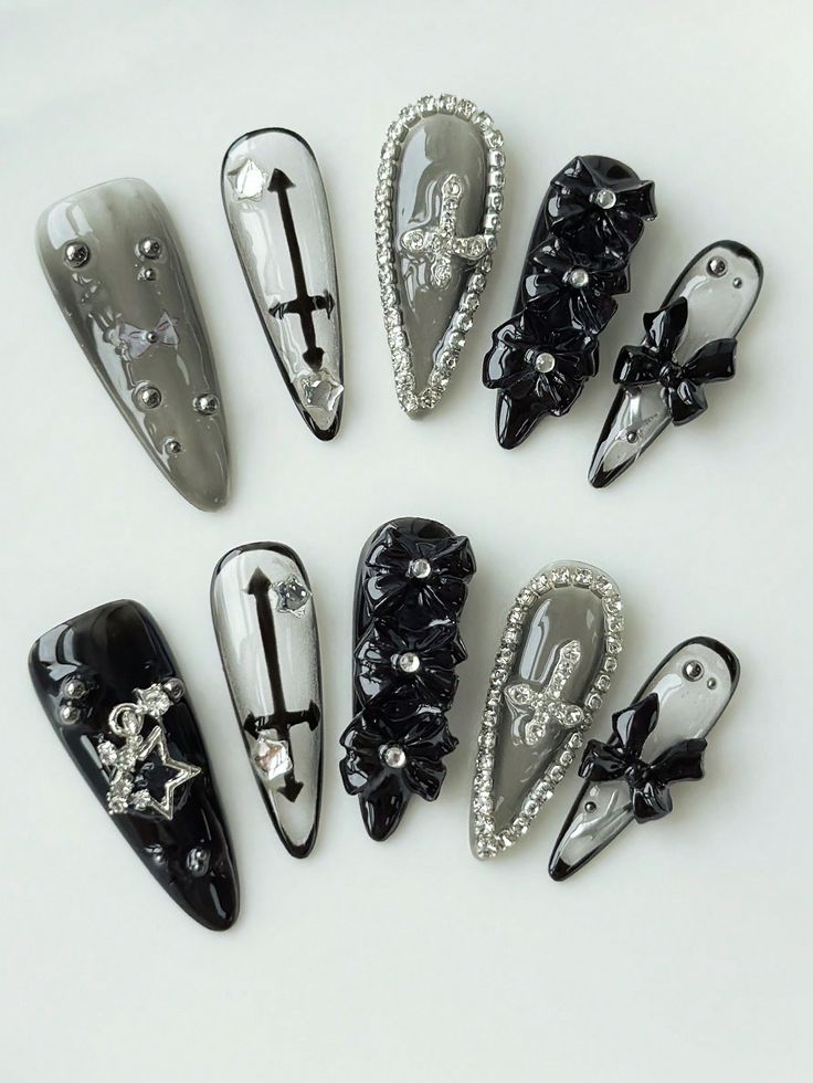 Elegant Black and Gray Nail Design with Stunning Embellishments and Dramatic Shapes.