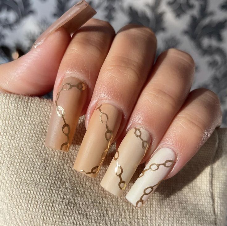 Chic Gradient Nail Design with Gold Accents for Elegant Glamour.