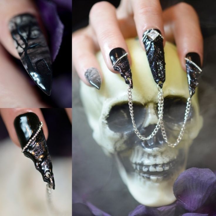 Dramatic Gothic Nail Design with Elongated Shapes and Silver Accents.