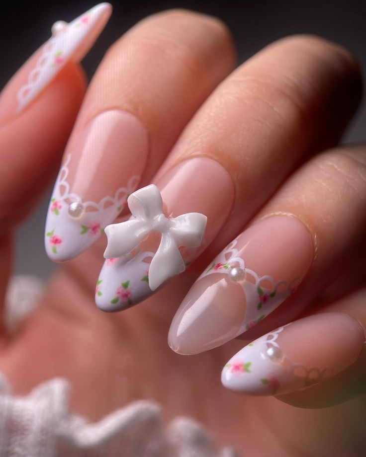 Whimsical Floral Nail Design with Pastel Colors, Lace, and 3D Bow Accents