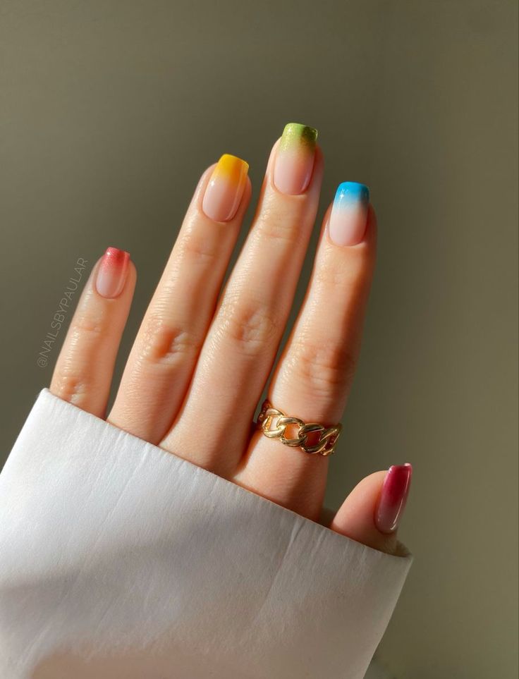 Vibrant Gradient Nails: A Playful Blend of Warm and Cool Ombre Hues.