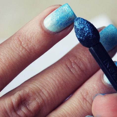 Elegant Gradient Nail Design: Smooth Light to Dark Blue Transition with Sparkling Accents.