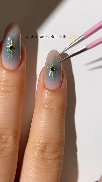 Stunning Pastel Gradient Nail Design with Celestial Gold Accents and Elegant Green Gem.