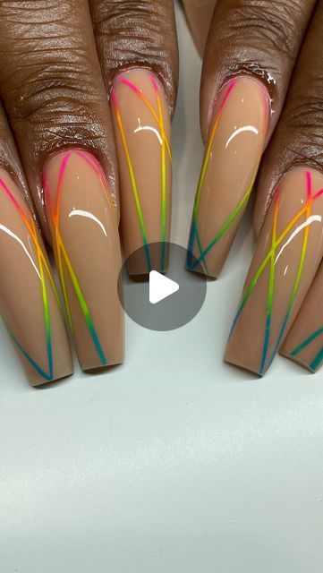 Chic Vibrant Nail Design: Nude Base with Bold Neon Lines and Elongated Tips