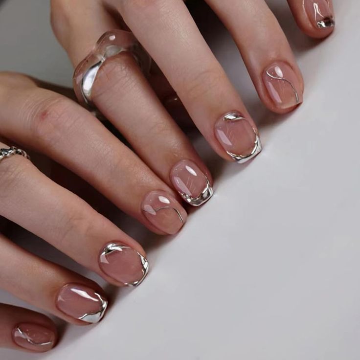 Chic Elegant Nude Nails with Delicate Silver Abstract Lines for Versatile Sophistication.