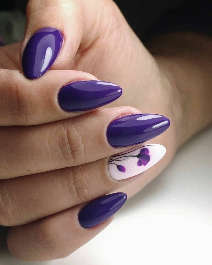 Elegant Almond-Shaped Purple Nails with Whimsical Floral Accent for Versatile Style.