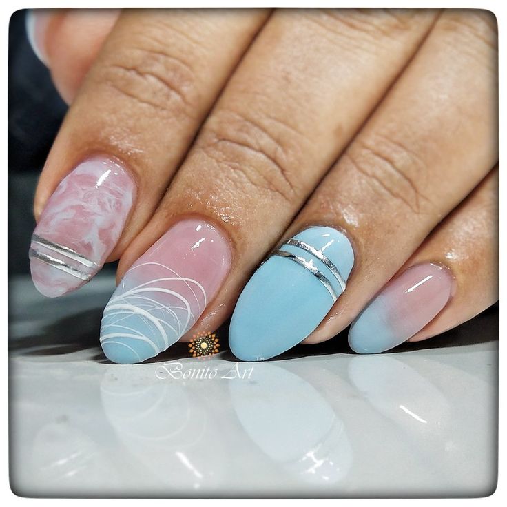 Stylish Colorful Nail Design with Marble Effects and Metallic Accents.