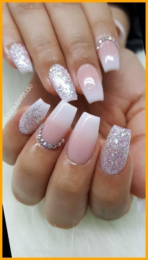 Chic Ombre and Glitter Nail Design with Rhinestone Embellishments.