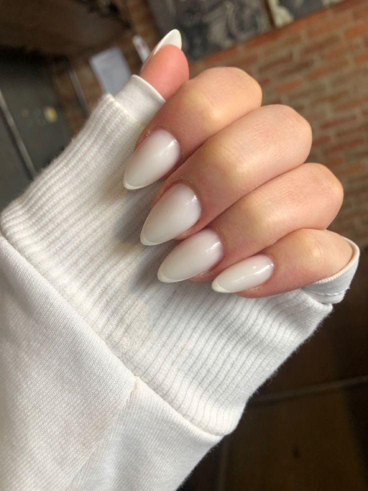 Chic Matte White Almond-Shaped Nails: A Versatile Touch of Sophistication.