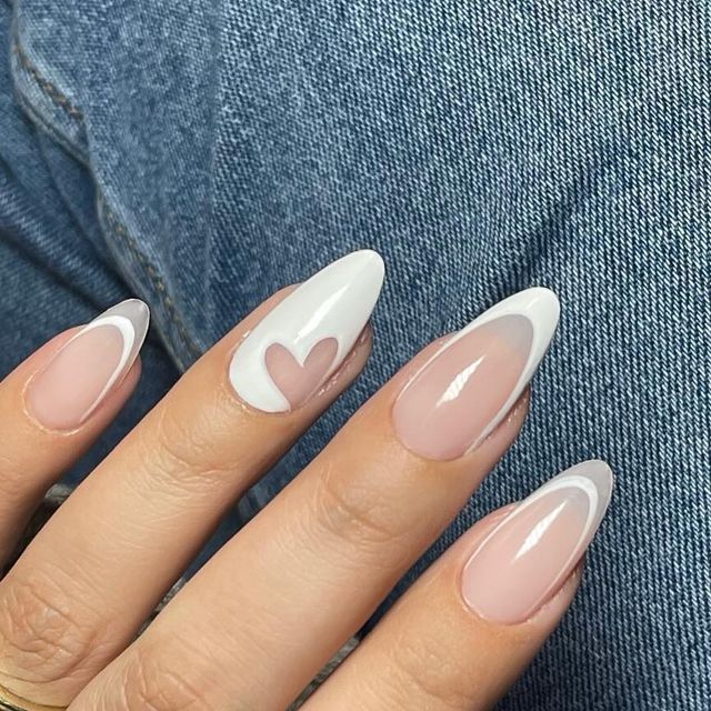 Chic Almond-Shaped Nails: Modern Design with Soft Pink, White, and Heart Accents.