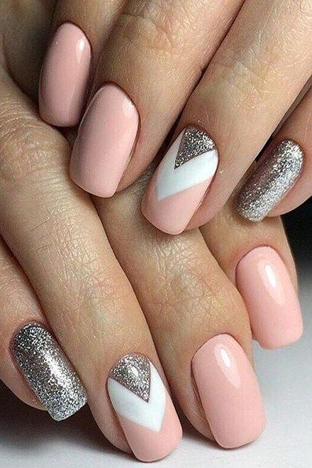 Sophisticated Soft Pink Nail Design with Sparkling Silver and Modern Chevron Accents.