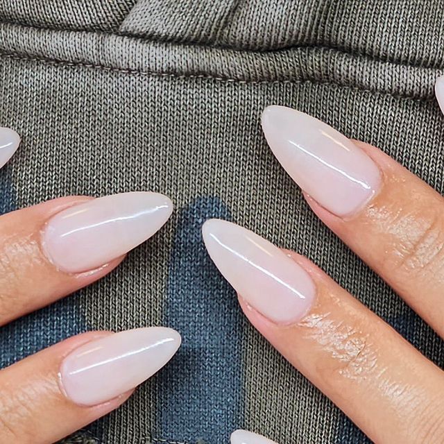 Elegant Almond-Shaped Nails: Translucent Hue and Subtle Shine for a Sophisticated Look.