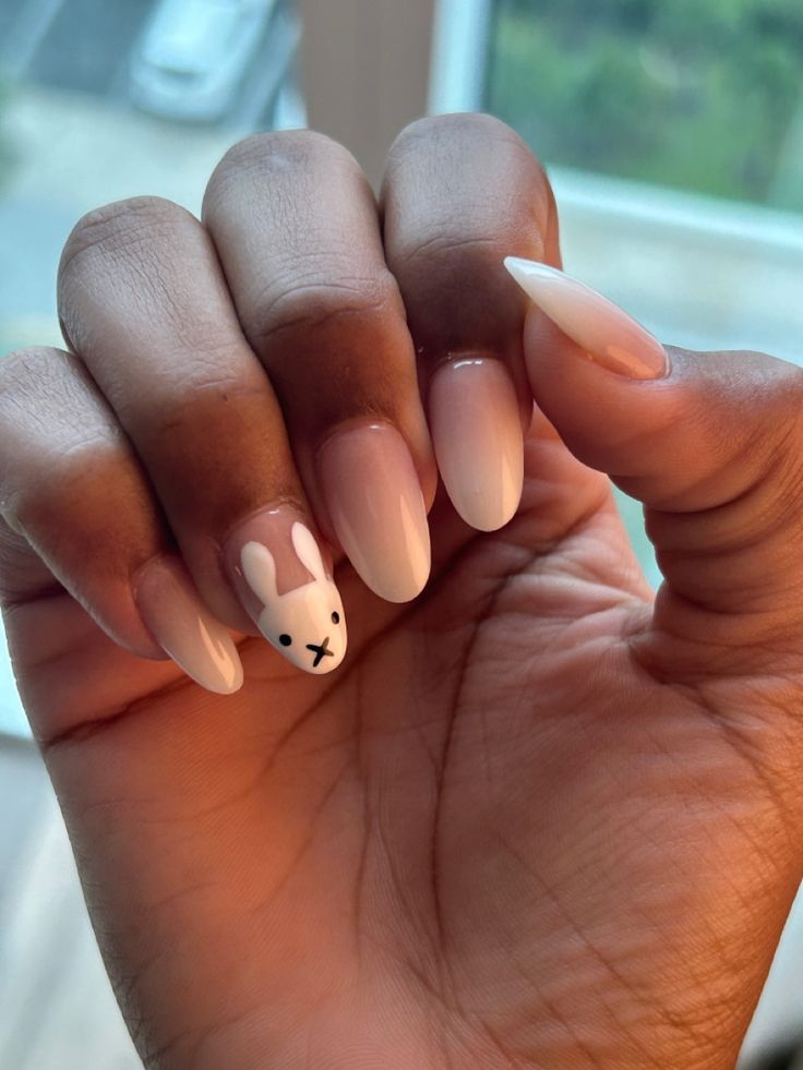 Charming Bunny-Themed Nail Design with Soft Nude and Glossy Finish