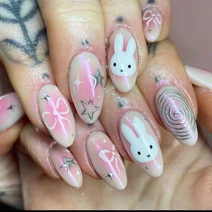 Whimsical Pastel Pink Nail Design with Bunny Accents and Sparkling Stars