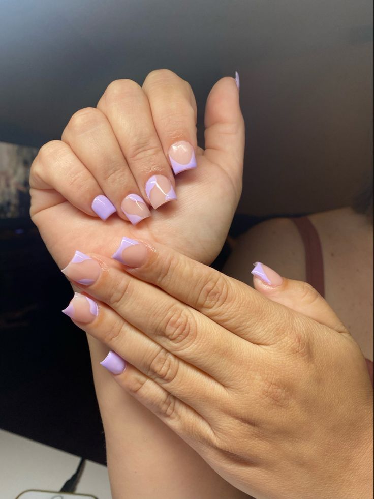 Trendy Lavender French Tip Nails with Negative Space: A Sophisticated Yet Playful Manicure.