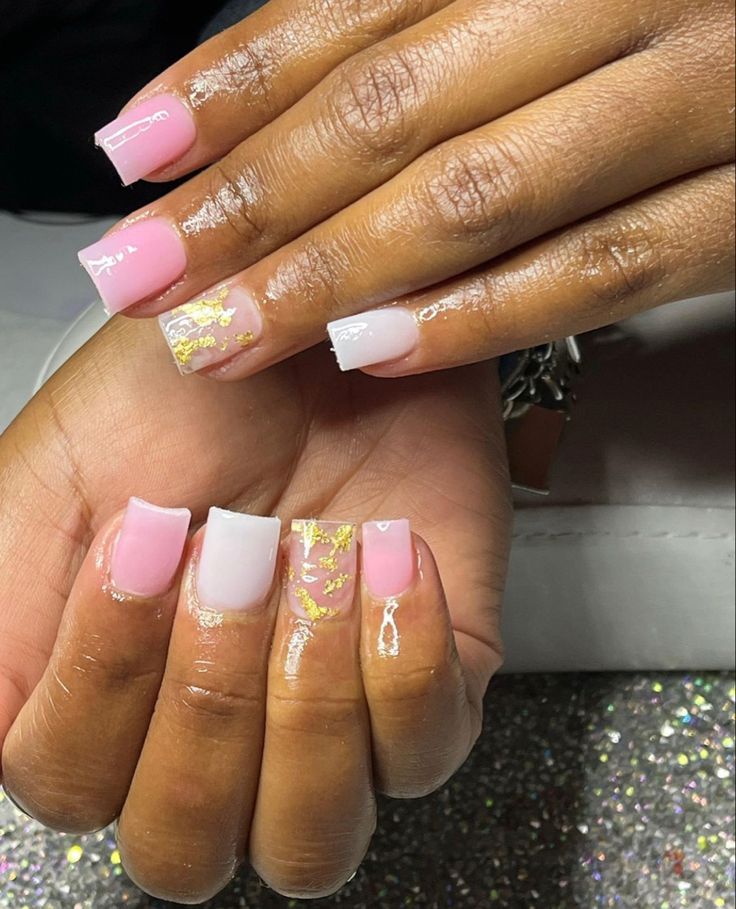 Sophisticated Chic: Elegant Nail Design with Soft Pink, Clear Polish, and Gold Accents.