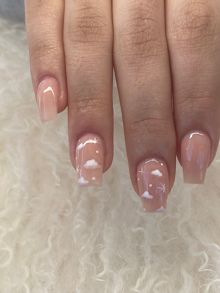 Dreamy Whimsical Nail Art with Soft Clouds and Stars on a Nude Base.